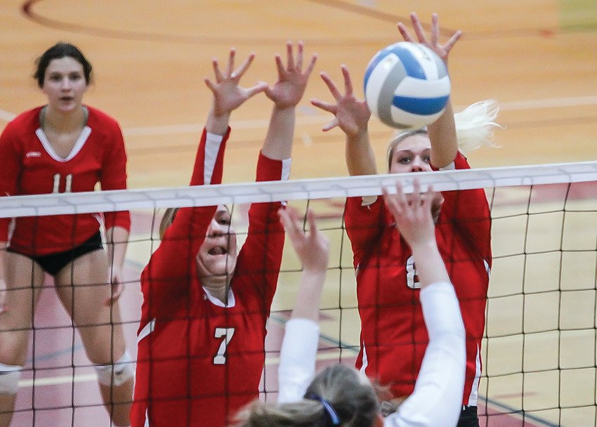 Ely seniors Audrey Thomas and Natasha Fulkrod pair up for a block against Cook County on Monday.