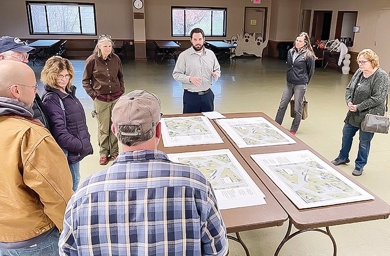 Tower City Clerk-Treasurer Michael Schultz discusses four alternatives developed as part of a recreational plan being developed for the area between the civic center and the   harbor.