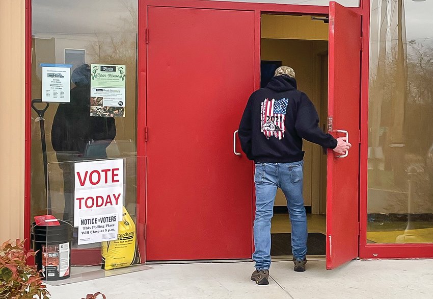 A voter makes his way into the Herbert R. Lamppa Civic Center in Tower on Tuesday, one of thousands who turned out across the region for the 2022 mid-term general   election.
