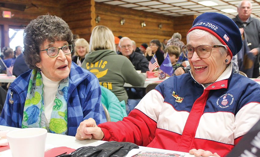 Longtime friends Adeline Broten, of Tower, and Corrine Schedlbauer, of Babbitt, enjoy each other&rsquo;s company during the monthly pancake breakfast put on by the Embarrass Fair Board.