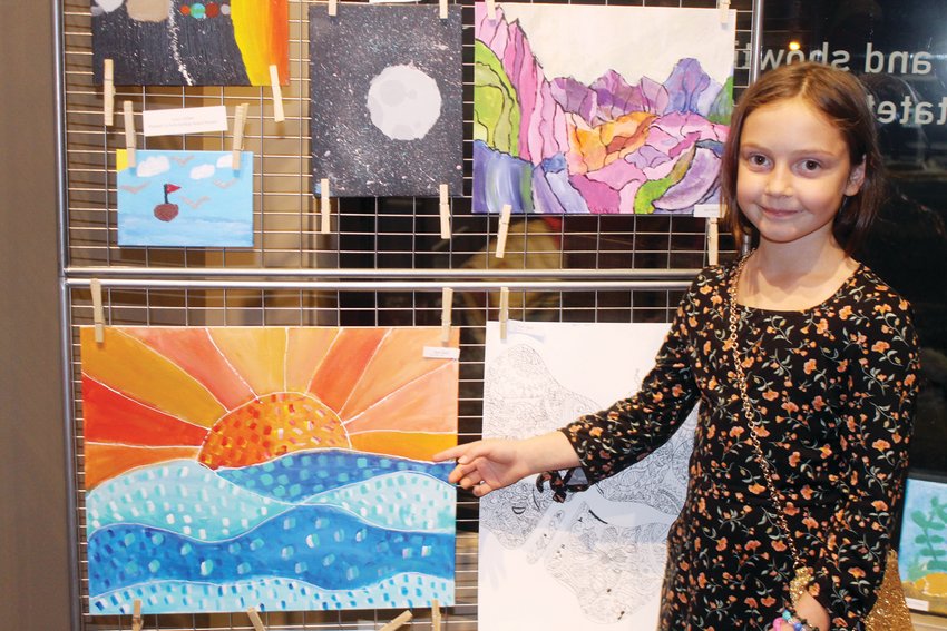 Suvi Kari shows off her art on display at the NLAA November art show at Ely&rsquo;s Historic State Theater.