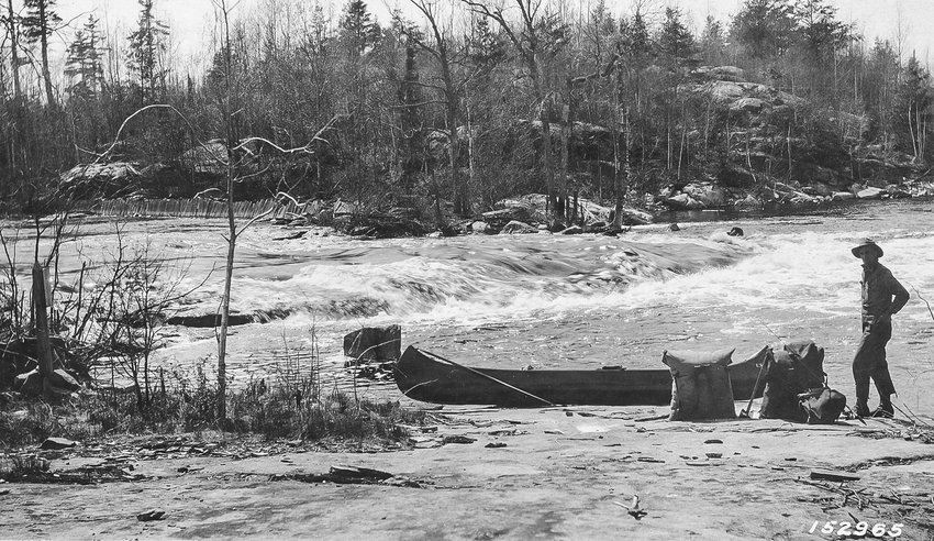 Arthur Carhart&rsquo;s   traveling companion, Forest Guard Matt Soderback, at a rapids on the Kawishiwi River.
