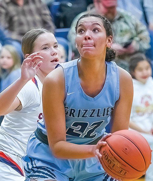The Grizzlies' Hannah Kinsey eyes a shot in a win against Nashwauk-Keewatin in which she scored 48 points to top the 1,000-point mark for her high school career.
