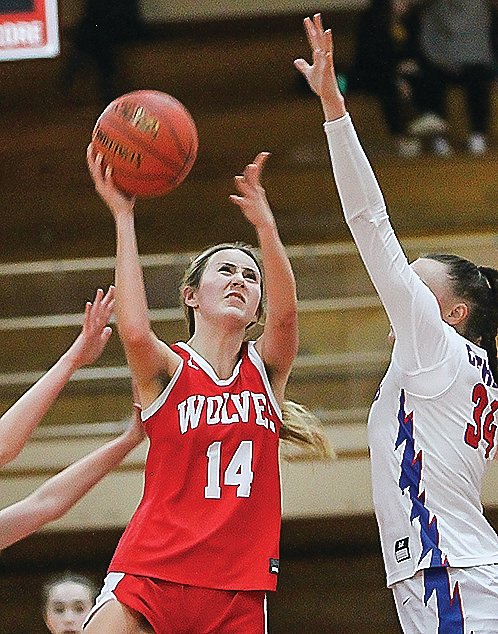 Ely&rsquo;s Madeline Perry goes up for a jumper in heavy traffic on Monday.