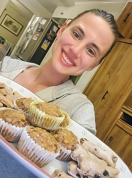 A selfie of Erica Lenci with a fresh batch of pupcakes.