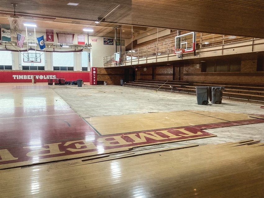 The floor of the Ely Memorial High School gymnasium where the top layer of water-damaged maple floorboards had already been removed. The floor was damaged by water from a pipe leak on March 17.