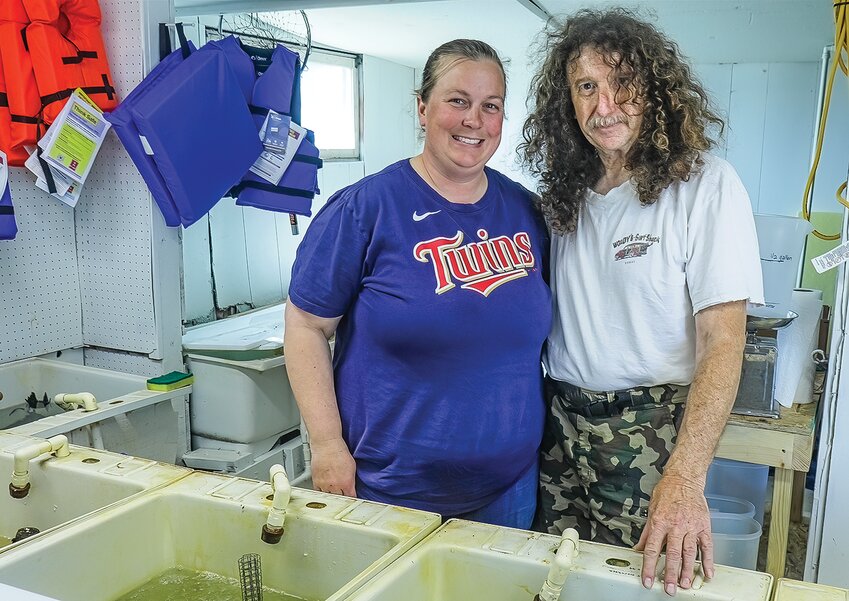 New co-owner Paula Dundas and now-former owner Joe Kruchowski behind the minnow tanks at Northwoods Bait and Tackle in Cook.