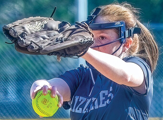 North Woods pitcher Helen Koch eyes the plate during her wind-up.