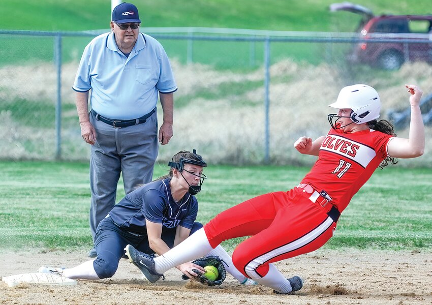 Ely&rsquo;s Rachel Coughlin slides in safe at second just ahead of the tag from the Grizzlies&rsquo; Karah Scofield.