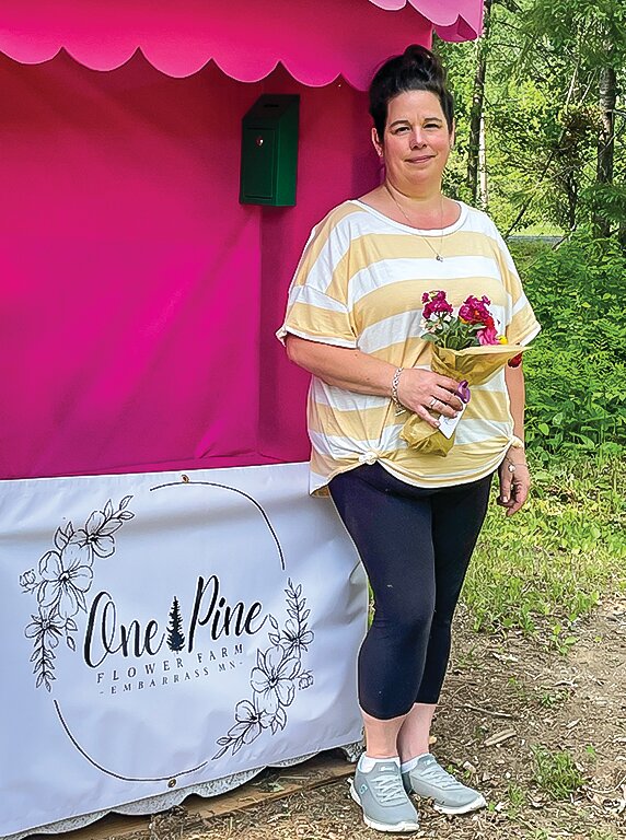 Amy Vesel with a handful of flowers from her new flower farming operation in Embarrass. Follow her on Facebook to see when flowers are available.