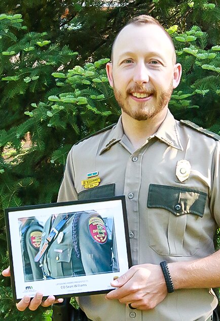 Ely area DNR conservation   officer Sean Williams was   recently recognized for his   efforts in the rescue of a   snowshoer in the Boundary   Waters last February.