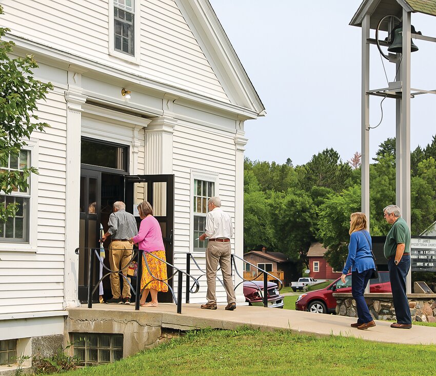 Worshippers line up to enter the St. James Presbyterian Chapel for the final sermon. Founded in 1884, the church was a center of spiritual life for many residents of Tower-Soudan for nearly 140 years.