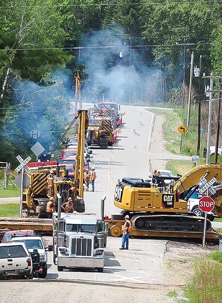 A plethora of heavy equipment is deployed near the site of this week&rsquo;s derailment along the CN track near Gheen.