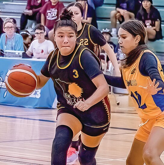 rynn Chosa drives against a British Columbia player in   the North American   Indigenous Games bronze medal game.