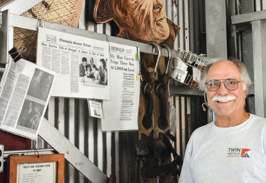 Pioneer Mine Museum volunteer Bill Erzar next to the museum&rsquo;s display of newspaper articles on his father&rsquo;s survival of the 1955 mining collapse that killed three, including his father&rsquo;s partner.