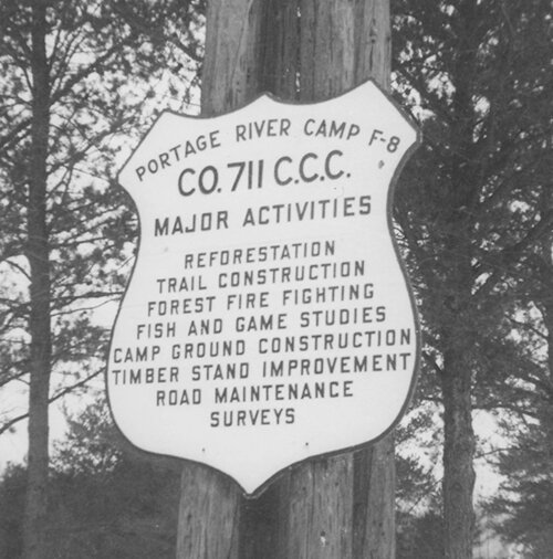 Sign listing the activities of CCC Camp 711 at Portage River.