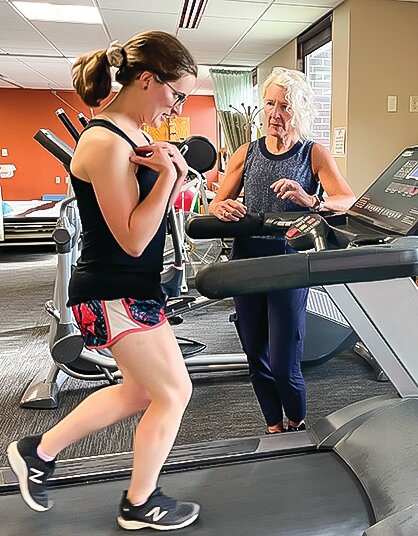 Brianna Crawford, who works in the radiology department at EBCH, will be part of a hospital marathon portage relay team. Toni Dauwalter was giving her a gait analysis on the hospital&rsquo;s treadmill.
