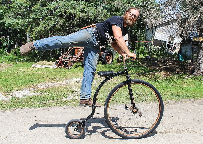 TJ Smith shows off on his penny farthing bicycle.