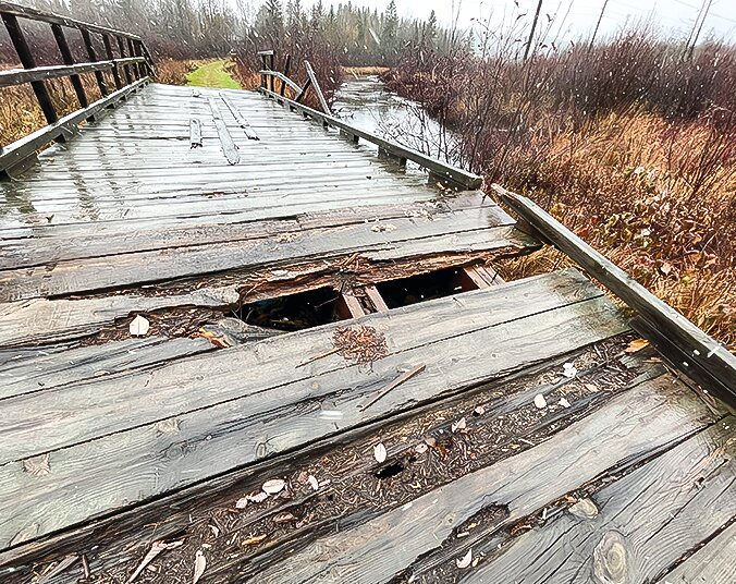 The snowmobile   bridge over the East Two   River in Tower as it was as of   mid-November. The missing and rotted decking and   collapsed guard rail have since been replaced.