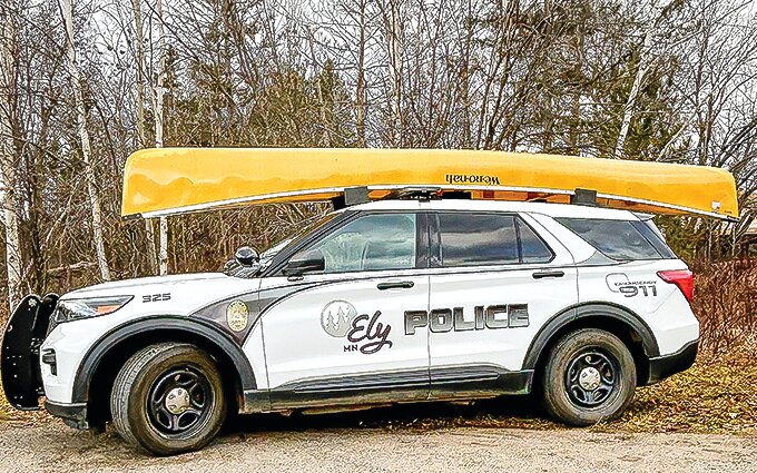 An Ely police cruiser with a canoe on top. The city&rsquo;s new incentive has proven to be a significant draw for new police applicants.