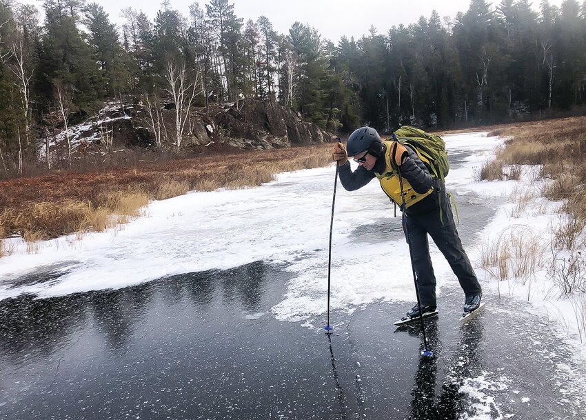 Checking the ice on the Hunting Shack River, northeast of Buyck earlier this month. The brief cold snap just after Thanksgiving allowed for several inches of ice to form on many small lakes and rivers.For wilderness adventures on ice, be sure to go   prepared. The backpack pictured here contains food, water, matches and other survival gear, as well as a complete change of clothes in a dry sack.
