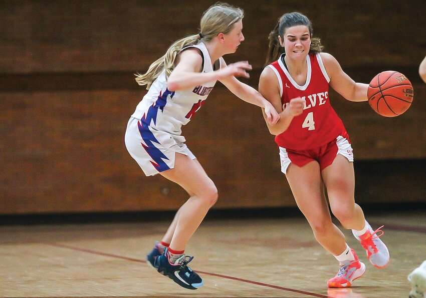 Senior Grace LaTourell concentrates as she brings the ball up court. LaTourell scored 28 points in Monday&rsquo;s contest.