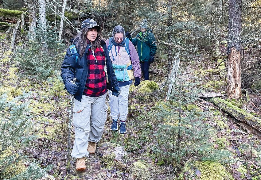 Clair Helmberger, Jodi Summit, and Victoria Ranua (partially obscured) made their way recently along the Norway Trail on the edge of a then-snowless BWCAW.
