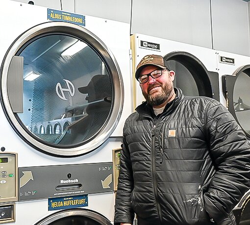 Joe Weise, new co-owner of the Laundry Room laundromat in Ely, with two of his dryers,   now named &ldquo;Albus Tumbledore&rdquo; and   &ldquo;Helga Hufflefluff.&rdquo;