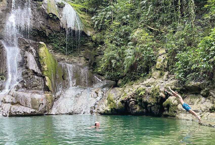 Enjoying a   natural pool in a Puerto Rican forest.