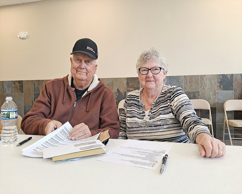 Long-time supervisor Chuck Tekautz joins his wife, Nancy, at a table in back of the meeting hall. Tekautz has retired after 18 years of service to the township.