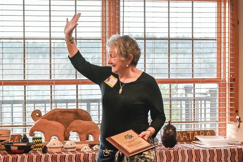 Lynn Evenson accepts the Pinetar Bob Cary Community Spirit Award on behalf of the Ely Winter Festival on April 11, 2024.