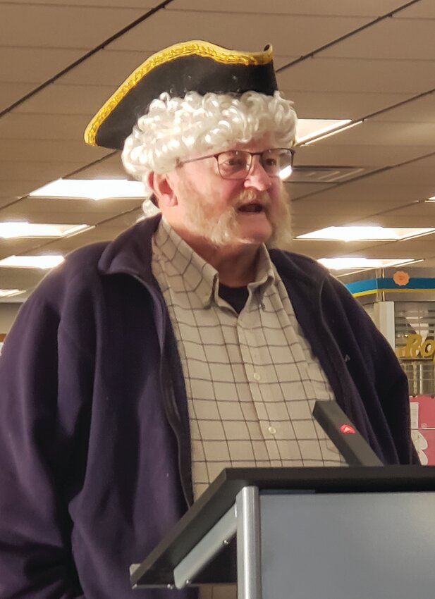 A tricorn hat and a white wig fit well with this man's message as he invoked the Founding Fathers in a call for a constitutional convention.