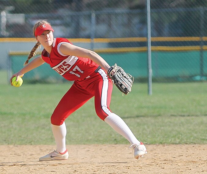 Ely senior shortstop   Hannah Penke eyes first base as she takes aim to throw out an International Falls batter.