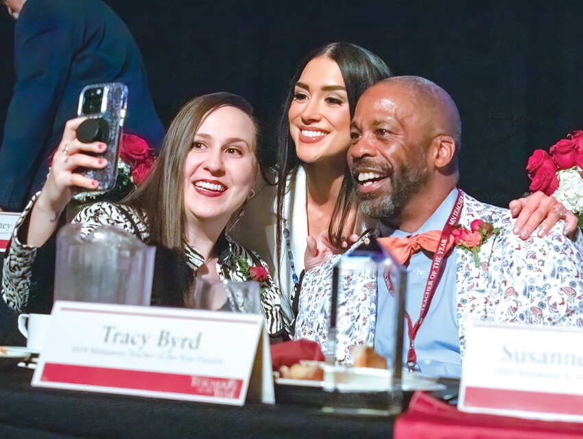Finalists Rebecca Buck, left, and Rachel Betterley, center, celebrate with Washburn High Minneapolis teacher Tracy Byrd moments after he was named the 2024 Minnesota Teacher of the Year on Sunday