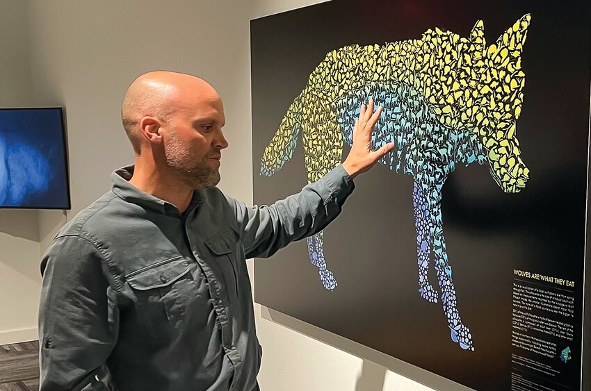 Joseph Bump of the University of Minnesota,  explains one of the images in the new exhibit.