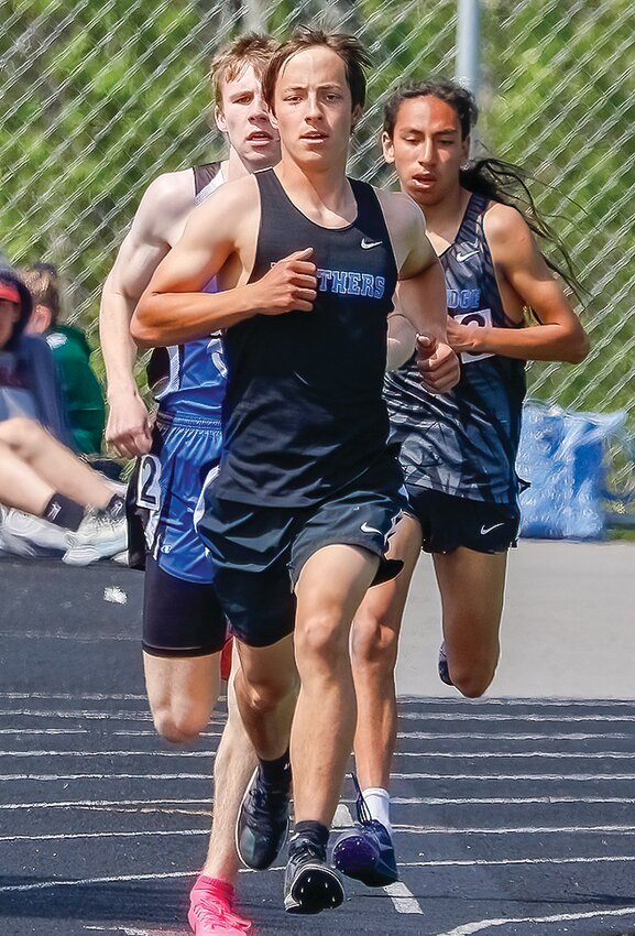 North Woods&rsquo; Alex Burckhardt leads the way in the 3200 meters, with fellow Grizzlies runner Kahlil Lightfeather-Spears, right, close behind.