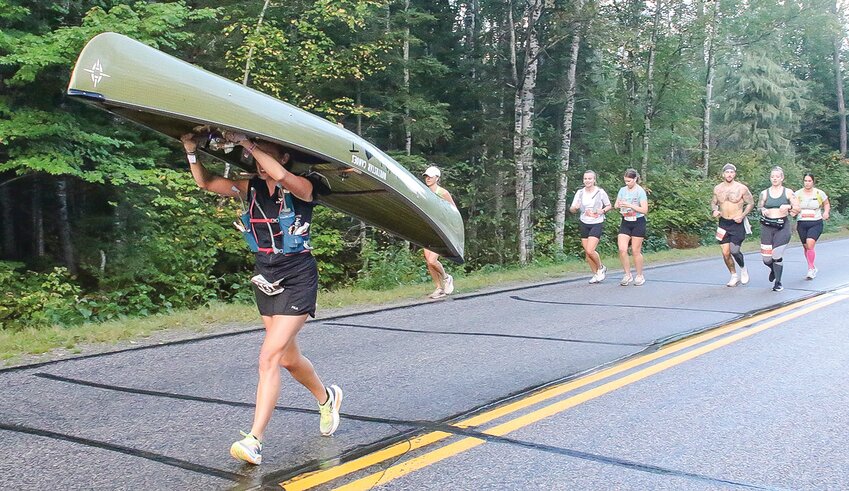 Victoria Ranua, of Shakopee, takes part in the full canoe portage marathon. Ranua crushed the   previous women's&rsquo; record by nearly an hour and a half.