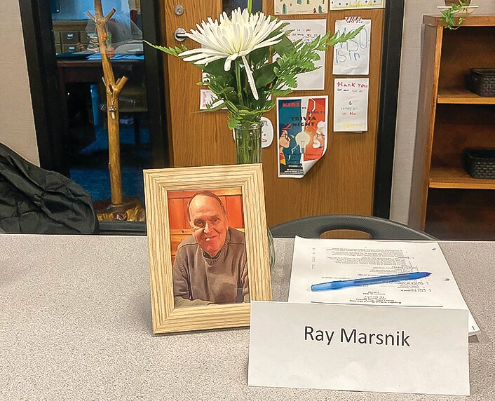 The school board&rsquo;s table included an empty seat and a makeshift memorial for long-time board chair Ray Marsnik, who died recently after a short illness.
