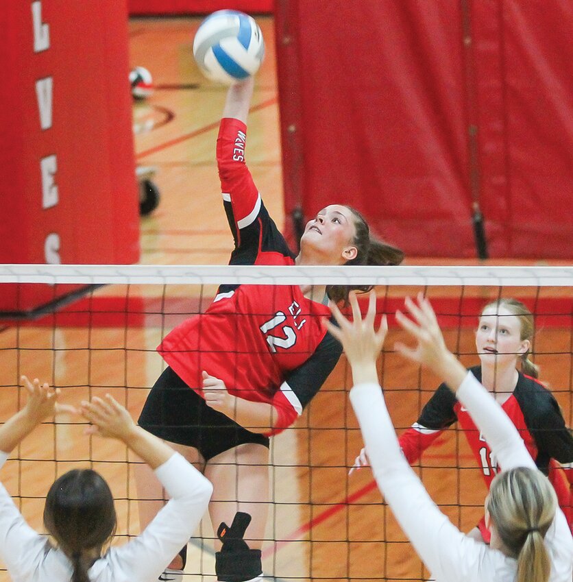Ely senior hitter Lilli Rechichi goes up high for a kill during Monday&rsquo;s regular season finale against Cook County.