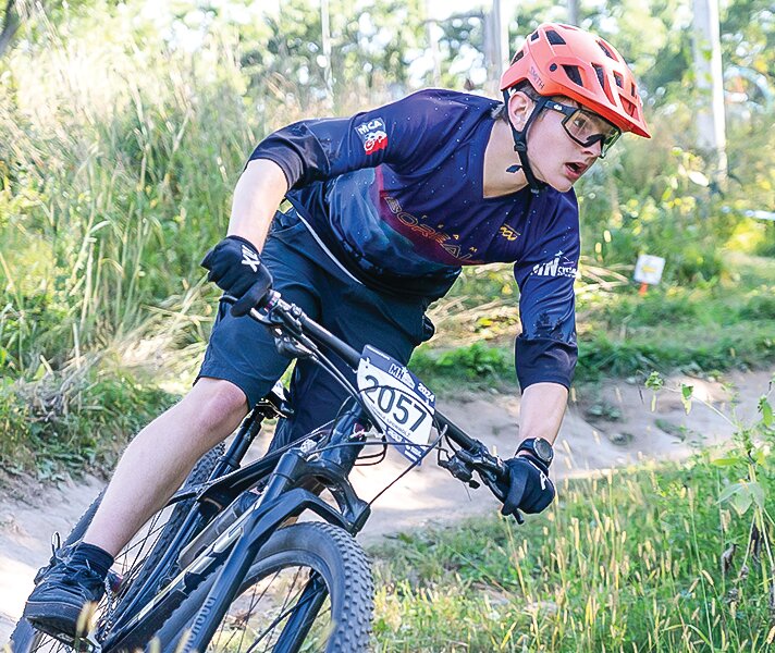 George Sponholz looks ahead as he leans into a tight corner during competition earlier this month in Cloquet. He also competed at the state meet, held this past weekend at the Redhead Mountain Biking Park in Chisholm, finishing 29th.