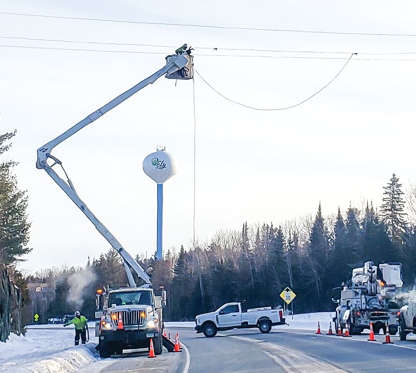 Minnesota Power employees rigging a new   transmission line over Hwy. 169 early Tuesday morning.