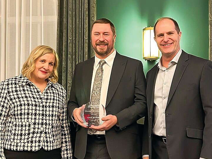 Adam Masloski, Executive Director of the Boundary Waters Care Center, received an award for outstanding leadership at the LeadingAge Minnesota conference in Minneapolis on Feb. 12. From left-to-right:&nbsp;Kari Thurlow, CEO of LeadingAge Minnesota, Adam Masloski, and Jerry Carley, chair of the LeadingAge Minnesota Board of Directors.