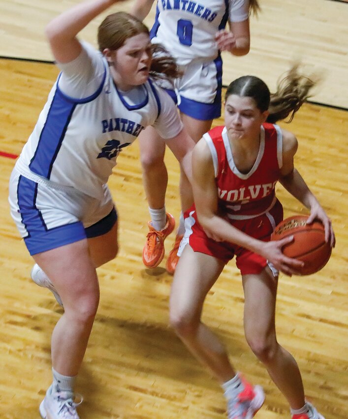 Ely&rsquo;s Lydia Shultz looks for room in the paint.