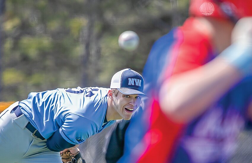 Talen Jarshaw keeps his eye on his pitch as it floats toward a waiting Chisholm batter.