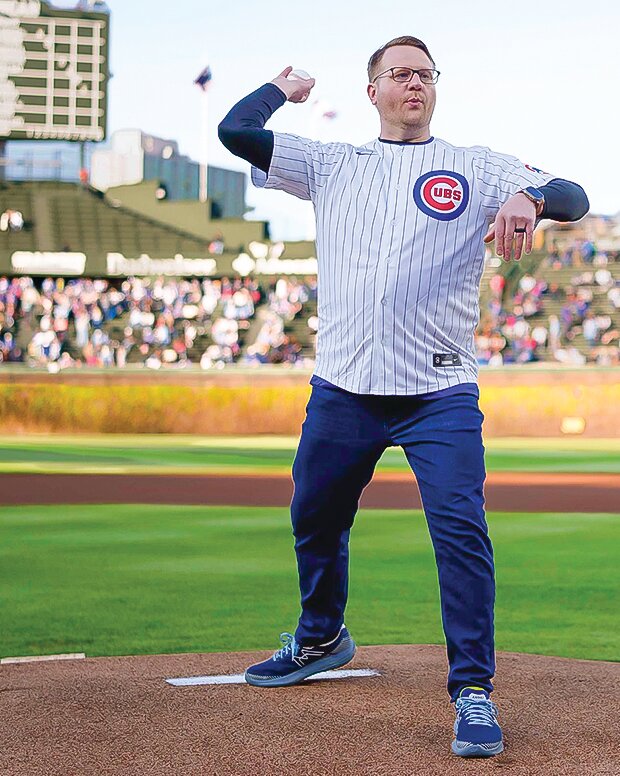 Cook native Trevor Nicholas throws out the first pitch in honor of Teacher Appreciation Night at   Wrigley Field in Chicago.