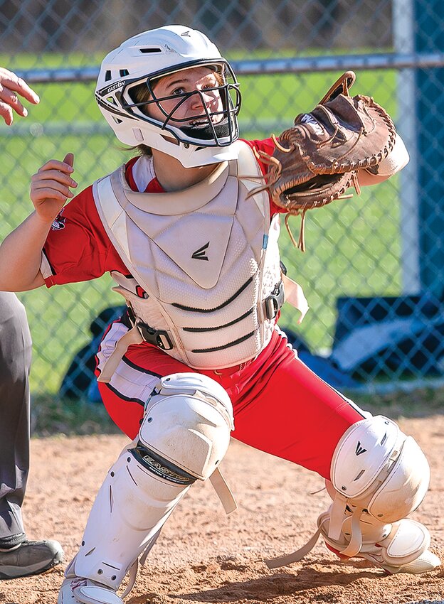 Ely catcher Peyton Huntington figured prominently in three of the four runs the Wolves scored against   North Woods.