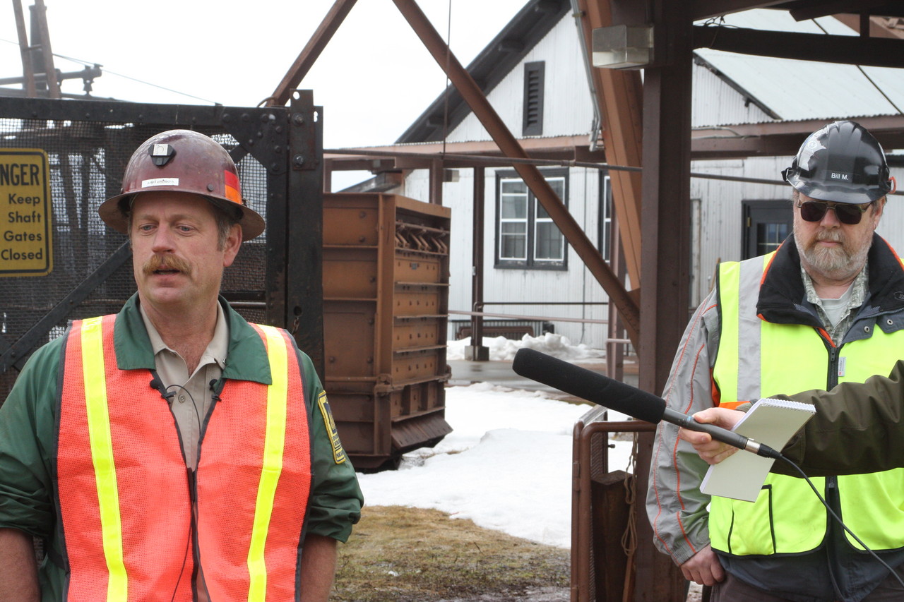 Park Manager Jim Essig answers questions during a press conference held at the park on Monday, while U of M Lab Manager Bill Miller looks on. The park remains closed until cleanup and a safety inspection have been completed.