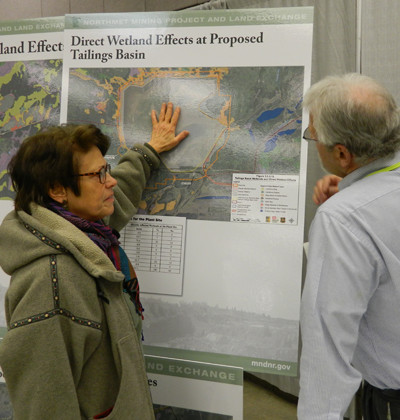A member of the public asks questions about wetland impacts from the proposed mine during a recent open house on the SDEIS.