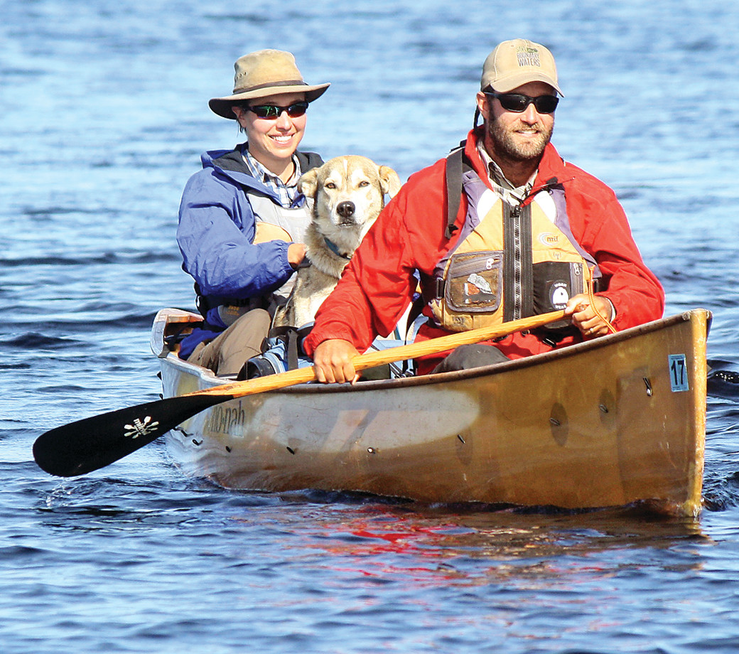 David and Amy Freeman, along with their adopted sled dog, “Tank,” paddle to the shore of River Point Resort and Outfitters on Birch Lake last Friday, 365 days after they left the same point to spend a year in the Boundary Waters Canoe Area Wilderness in an effort to draw attention to the risks of a proposed sulfide mining project adjacent to the wilderness.