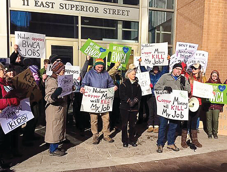 Protesters gathered outside Congressman Rick Nolan's office in Duluth yesterday to express their displeasure over his attempt to get the Trump administration to wade into a debate over copper-nickel mining in northeastern Minnesota.